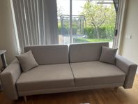 Dubbelfunktionell soffa (soffa och säng)
