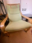 Ikea chair with green pillow