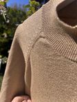 Tröja i glittrig guld från Lindex