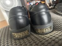 Guess svarta med guld 