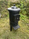 liten kamin med kokplatta