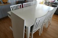 Matbord med sex stolar och extraskiva