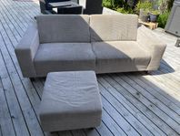 soffa med fotpall i manshestertyg
