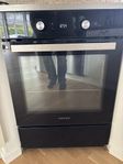 Spris / Ugn Svart med rostfria detaljer Grundig