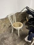 two wood and ratan chairs