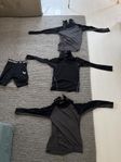 halsskydds tröjor och ett suspensuarshorts.