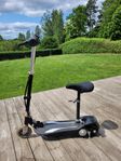 elsparkcykel med sits