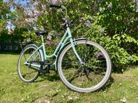 Ljusblå Monark Damcykel