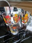 glas med nalle puh och en tom & jerry