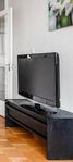 40" LED TV with Chromecast Google TV box and TV table.