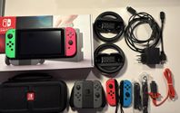 Nintendo Switch med kartong, extra kontroller och tillbehör