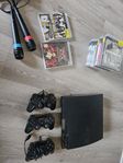 ps3 med 3 handkontroller och 12 spel samt microfoner