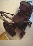 barnvagn och spjälsäng stokke