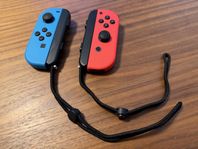 Två joy-con med grip tillbehöret