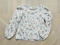 Blommig tröja Newbie strl 86/92