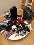 Playstation 2 inkl Guitar Hero, Singstar, Dansmatta, Buss