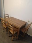 Wooden dinner table with 4 chairs.