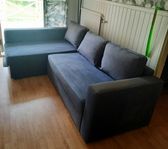 IKEA bäddsoffa mörkgrå.