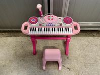 Rosa barnkeyboard med pall