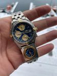 Breitling Chronomate B.13050.1 UTC guld/stål bra skick+kvit