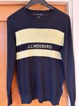 svart tröja med gul detalj från J.Lindeberg