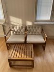 Lounge chairs with pillows and table