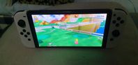 Nintendo Switch OLED med spel och tillbehör