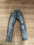 snygga slitna jeans 152