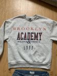 Grå college tröja 