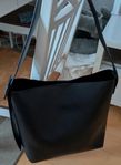 Toteväska med spänne 
