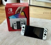 Nintendo Switch OLED – komplett med kartong och tillbehör