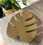 Snyggt underlägg grytunderlägg design Monstera guld metall
