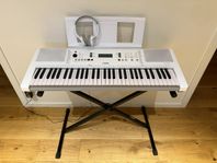 Yamaha EZ-300 med X-stativ och hörlurar