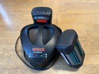 Bosch laddare med batteri till gräsklippare