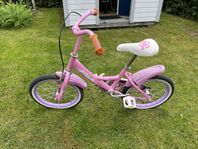 Pollux rosa barncykel med löstagbara stödhjul.