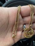 18k pansarhalsband med oxen hänge