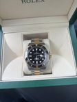 Rolex submariner 41 guld/stål svart 