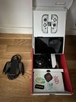 Nintendo Switch OLED vit + extra laddningsbar comfort grepp