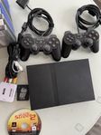 PlayStation 2 Slim med 14 spel, 2 handkontroller