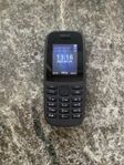 Nokia knapptelefon med laddare
