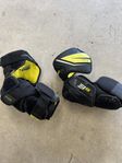 Armbågsskydd hockey bauer