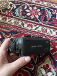 videokamera och stativ