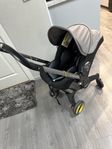 Doona+ babyskydd med spädbarninlägg