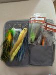 12 pike flies and 3 poppers