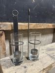 Vägghängda ljuslyktor i metall och glas