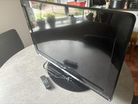 Sharp TV med fot och fungerande fjärrkontroll