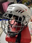 Ishockeyhjälm CCM med galler - oanvänd