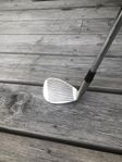 Sandwedge, och en TaylorMade TP5x Pix boll