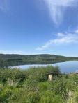 Sjönära sommarstuga / stugtomt