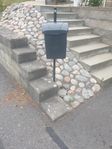 postlåda på stolpe